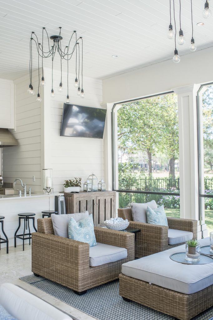 Large transitional stone screened-in back porch idea in Orlando with a roof extension by Ashley Martin Home | Outdoor Photos | Porch | Landscaping | Landscape Design | Outdoor Living Space | Porch Design Ideas | Outdoor Living Space Ideas | Backyard Design