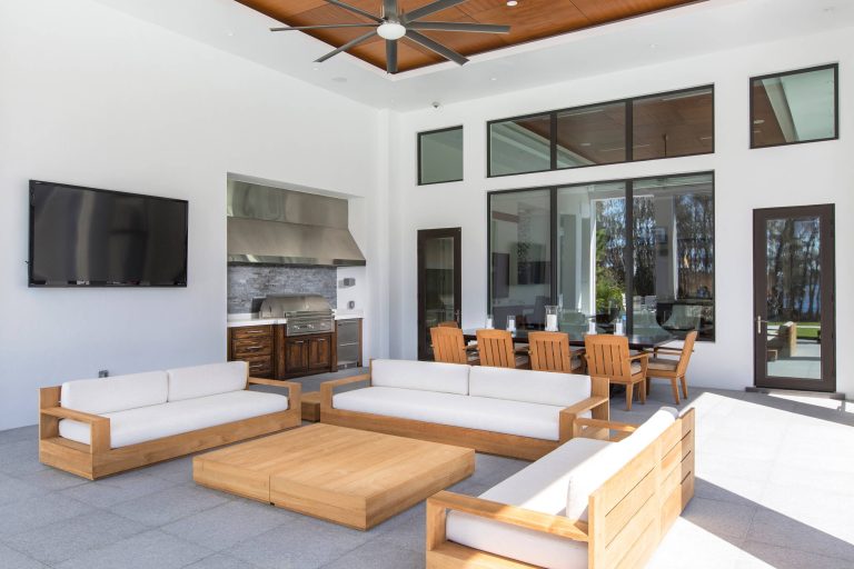 Large trendy backyard patio kitchen photo in Orlando with a roof extension