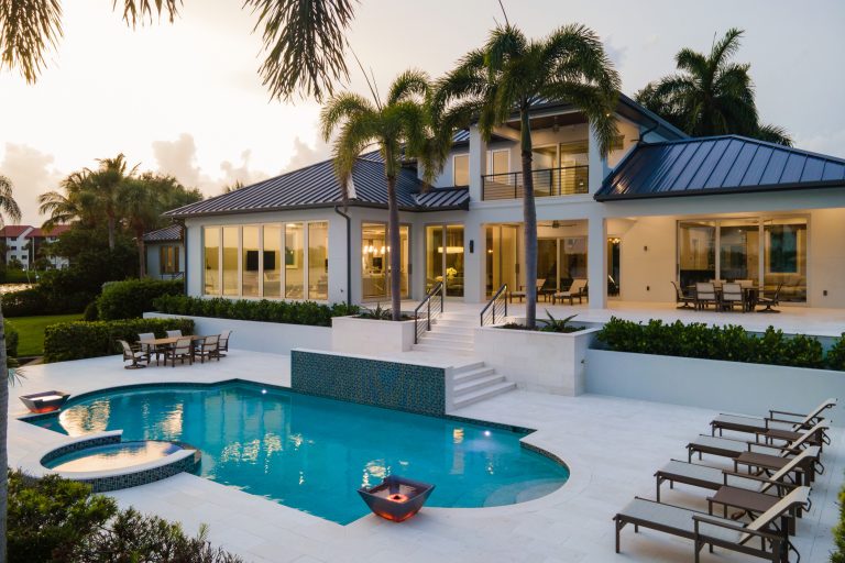 Large trendy backyard stone and custom-shaped lap hot tub photo in Tampa