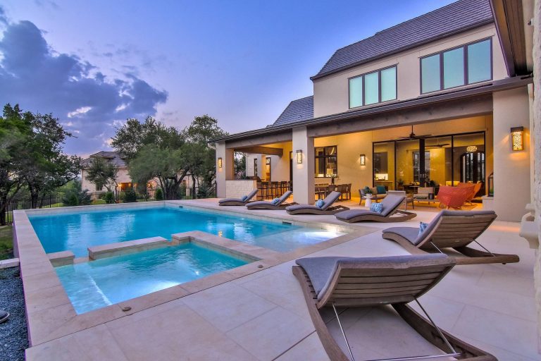 Large trendy backyard tile and rectangular lap hot tub photo in Austin