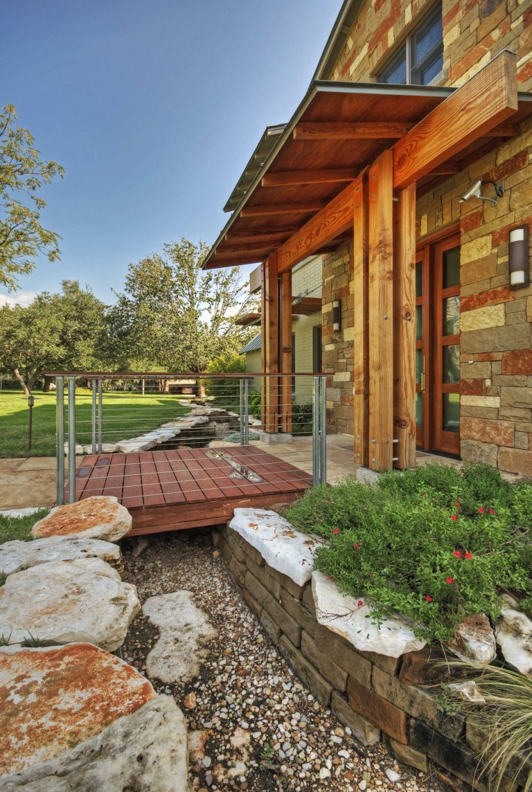 Large trendy front porch photo in Austin by Pearson Landscape Services | Outdoor Photos | Porch | Landscaping | Landscape Design | Outdoor Living Space | Porch Design Ideas | Outdoor Living Space Ideas | Backyard Design
