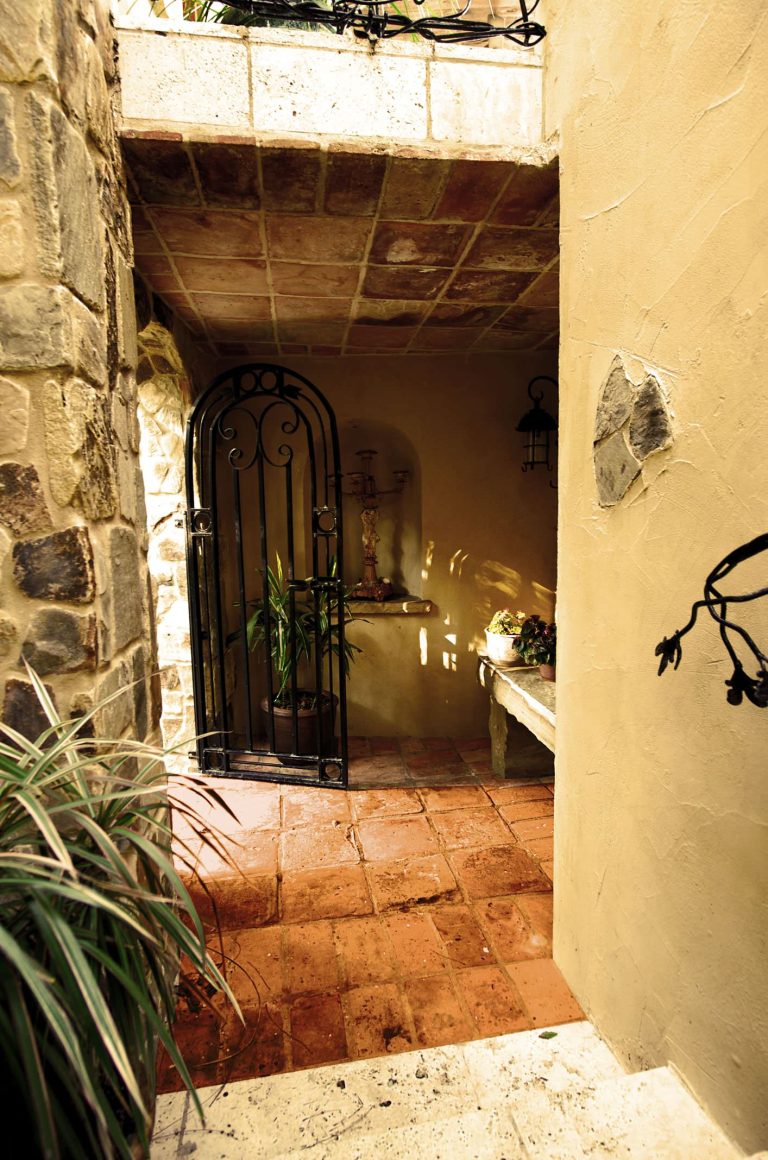 Large tuscan backyard concrete paver patio kitchen photo in Atlanta with a pergola