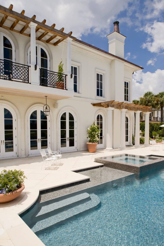 Large tuscan backyard pool photo in Jacksonville