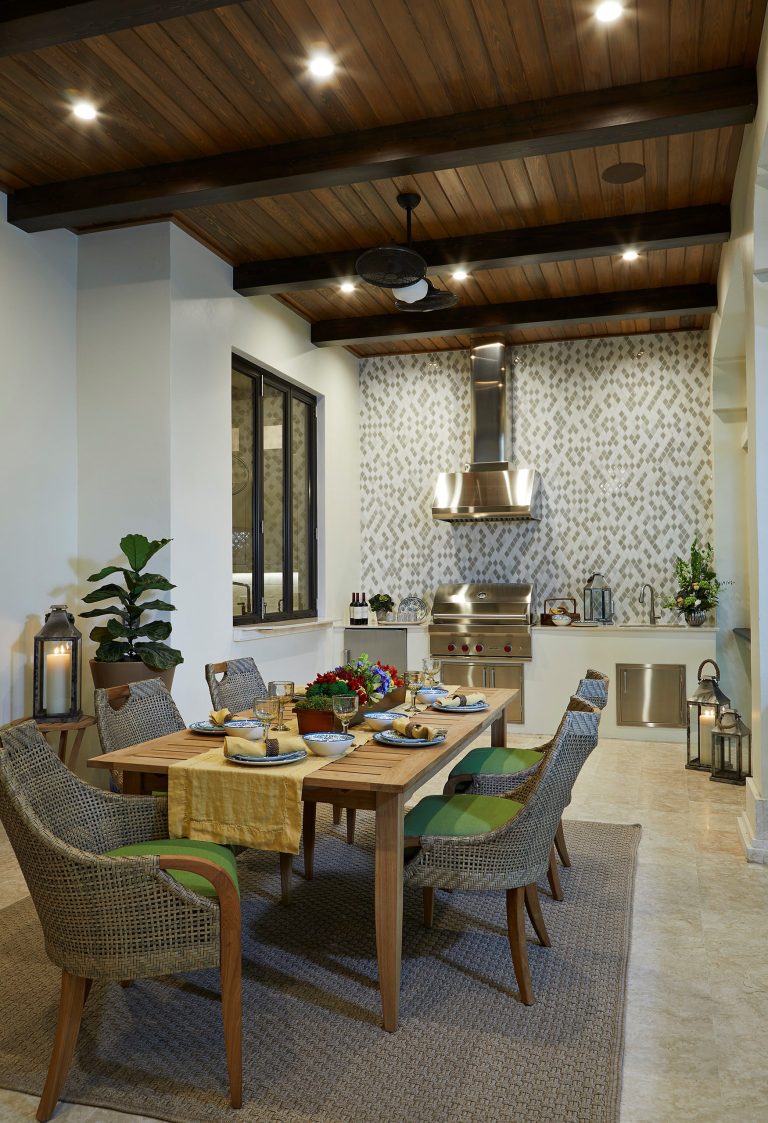 Large tuscan backyard tile patio kitchen photo in Tampa with a roof extension