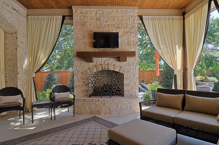 Large tuscan concrete back porch idea in Dallas with a roof extension and a fire pit by Stewart Custom Homes | Outdoor Photos | Porch | Landscaping | Landscape Design | Outdoor Living Space | Porch Design Ideas | Outdoor Living Space Ideas | Backyard Design