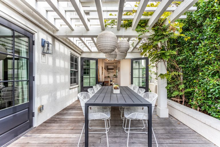 Light-flooded and airy patio adjacent to the kitchen. really carries the urban farmhouse feel outside!