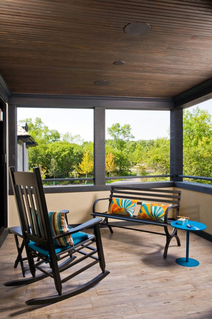 Linda Oyama Bryan, photographer This open, second floor covered porch, with porcelain tile floor that mimics hardwood, also features a dark stained beadboard ceiling and iron railing. by Orren Pickell Building Group | Outdoor Photos | Porch | Landscaping | Landscape Design | Outdoor Living Space | Porch Design Ideas | Outdoor Living Space Ideas | Backyard Design