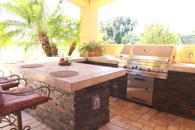 Location: Tampa, FL, USA Hive Outdoor Living Water bowls, bubblers, custom planters, Natural Travertine deck.
