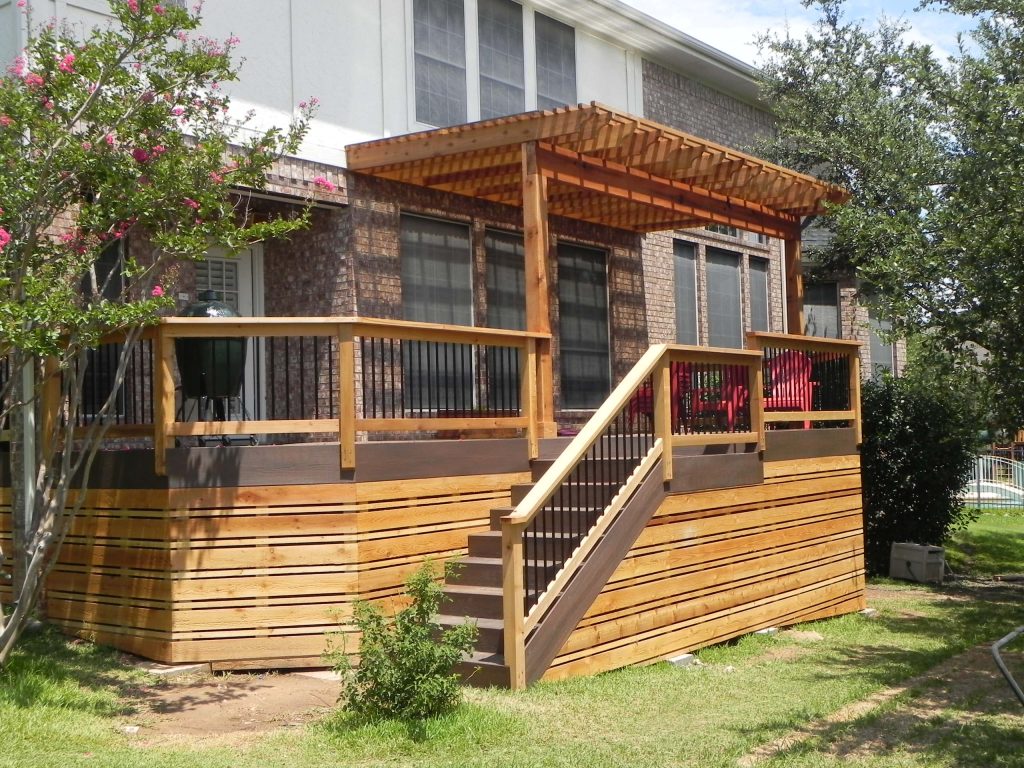 Low maintenance, composite deck with partial wood pergola, and cedar skirting below.