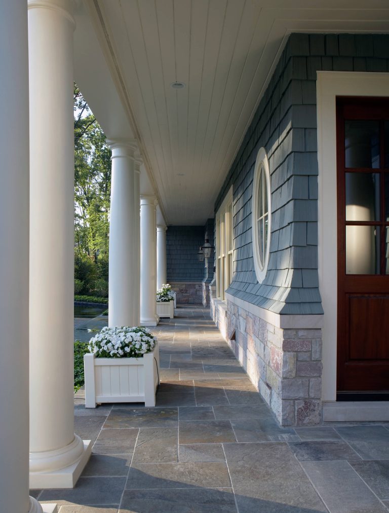 Maintaining disciplined restraint, the palette of materials for each façade is limited to cedar shakes and stone, yet the variety of forms is evocative and dazzling. by Saroki Architecture | Outdoor Photos | Porch | Landscaping | Landscape Design | Outdoor Living Space | Porch Design Ideas | Outdoor Living Space Ideas | Backyard Design
