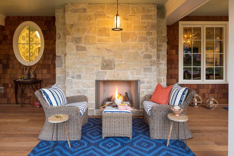 Make the most of outdoor living and add a fireplace to your porch so you can enjoy the space year-round! Built by Great Neighborhood Homes, Photography by Troy Thies, Landscaping by Moms Landscaping by Laura Engen Interior Design | Outdoor Photos | Porch | Landscaping | Landscape Design | Outdoor Living Space | Porch Design Ideas | Outdoor Living Space Ideas | Backyard Design