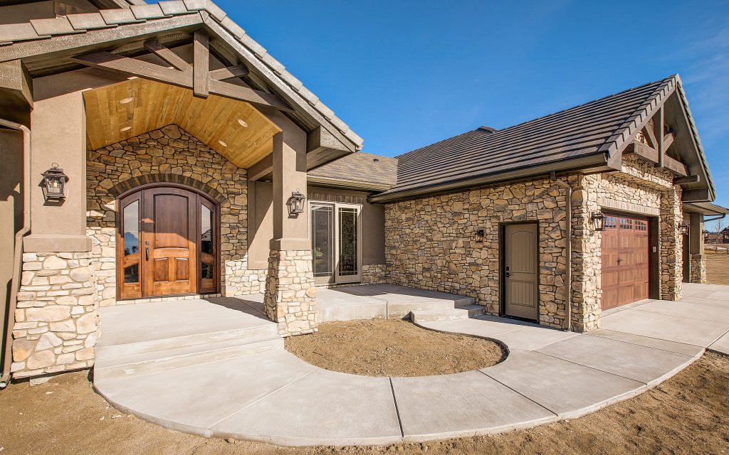 Mid-sized arts and crafts concrete front porch idea in Denver with a roof extension by Riverwood Homes of Colorado | Outdoor Photos | Porch | Landscaping | Landscape Design | Outdoor Living Space | Porch Design Ideas | Outdoor Living Space Ideas | Backyard Design