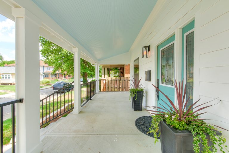 Mid-sized arts and crafts concrete front porch photo in Indianapolis with a roof extension by GMG Architects | Outdoor Photos | Porch | Landscaping | Landscape Design | Outdoor Living Space | Porch Design Ideas | Outdoor Living Space Ideas | Backyard Design