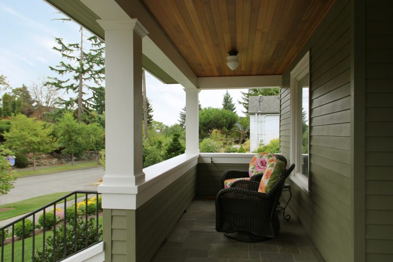 Mid-sized arts and crafts stone front porch idea in Seattle with a roof extension by eric gedney | ARCHITECT | Outdoor Photos | Porch | Landscaping | Landscape Design | Outdoor Living Space | Porch Design Ideas | Outdoor Living Space Ideas | Backyard Design
