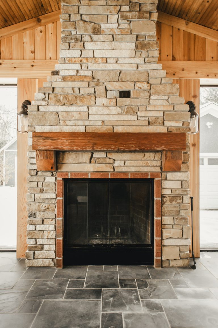 Mid-sized arts and crafts tile back porch idea in Minneapolis with a fireplace and a roof extension by Niedfeldt Home Remodeling | Outdoor Photos | Porch | Landscaping | Landscape Design | Outdoor Living Space | Porch Design Ideas | Outdoor Living Space Ideas | Backyard Design