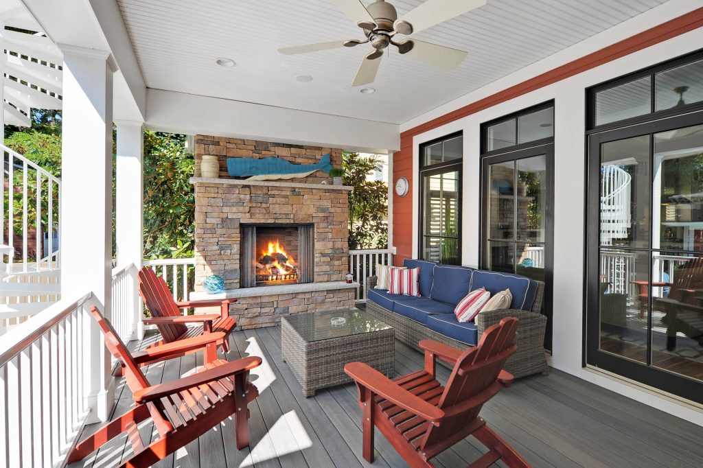 Mid-sized beach style back porch idea in Philadelphia with a fire pit, decking and a roof extension by Echelon Custom Homes | Outdoor Photos | Porch | Landscaping | Landscape Design | Outdoor Living Space | Porch Design Ideas | Outdoor Living Space Ideas | Backyard Design