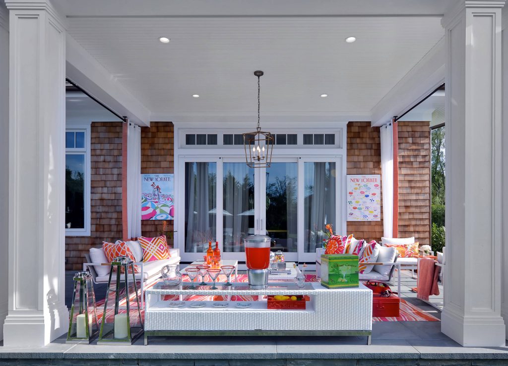 Mid-sized beach style concrete paver back porch photo in New York with a roof extension by Anne Tarasoff Interiors | Outdoor Photos | Porch | Landscaping | Landscape Design | Outdoor Living Space | Porch Design Ideas | Outdoor Living Space Ideas | Backyard Design