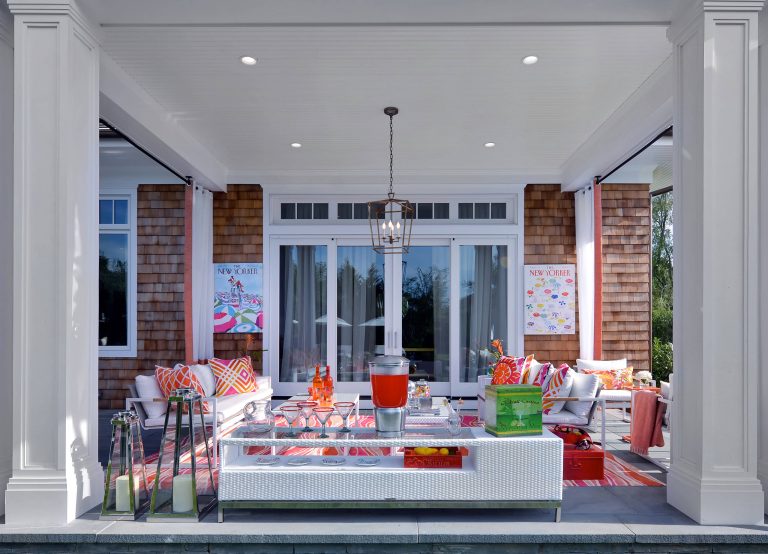 Mid-sized beach style concrete paver back porch photo in New York with a roof extension by Anne Tarasoff Interiors | Outdoor Photos | Porch | Landscaping | Landscape Design | Outdoor Living Space | Porch Design Ideas | Outdoor Living Space Ideas | Backyard Design