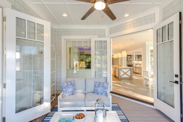 Mid-sized beach style screened-in back porch photo in Other with decking and a roof extension by Stephen Alexander Homes & Neighborhoods | Outdoor Photos | Porch | Landscaping | Landscape Design | Outdoor Living Space | Porch Design Ideas | Outdoor Living Space Ideas | Backyard Design