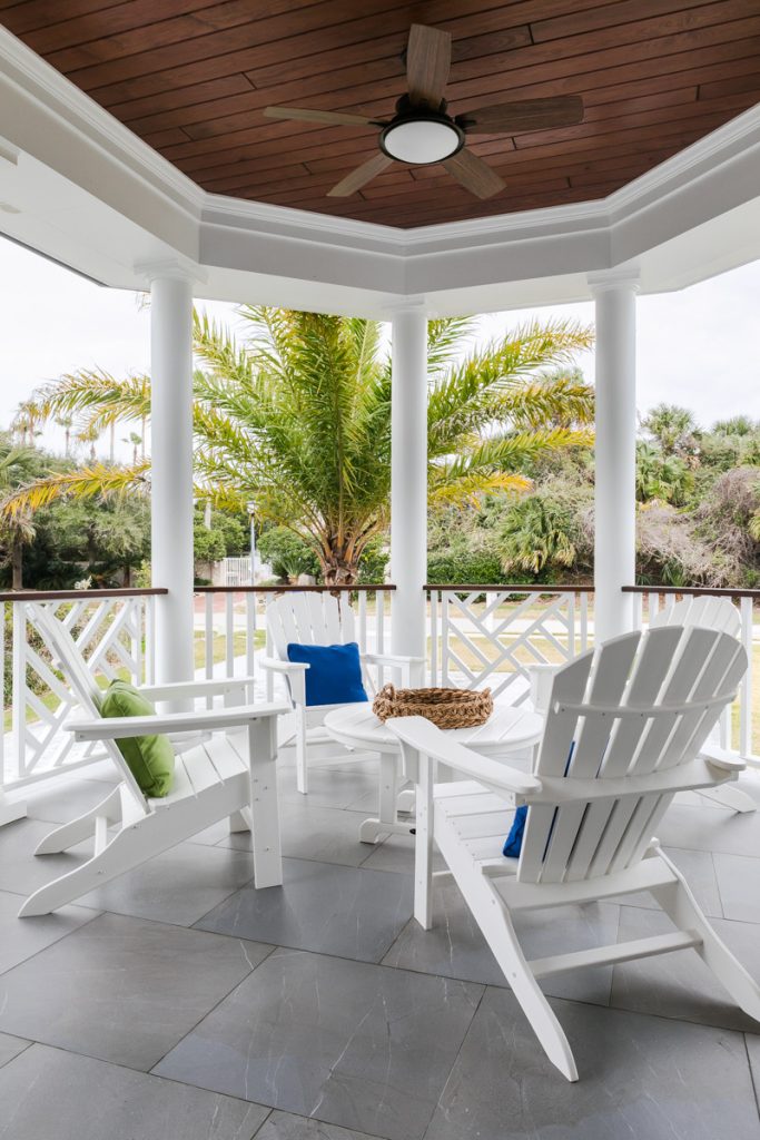 Mid-sized beach style tile back porch idea in Jacksonville with a roof extension by Heritage Homes of Jacksonville | Outdoor Photos | Porch | Landscaping | Landscape Design | Outdoor Living Space | Porch Design Ideas | Outdoor Living Space Ideas | Backyard Design