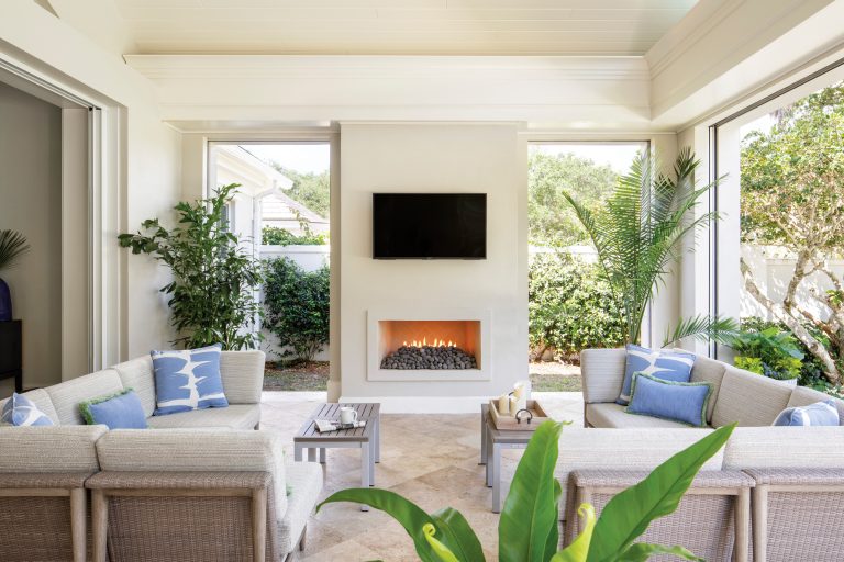 Mid-sized beach style tile screened-in back porch photo in Miami with a roof extension by Stacy Miller Design | Outdoor Photos | Porch | Landscaping | Landscape Design | Outdoor Living Space | Porch Design Ideas | Outdoor Living Space Ideas | Backyard Design