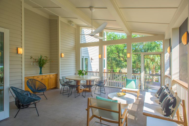 Mid-sized beach style tile screened-in side porch photo in Charleston with a roof extension by Rosenblum Coe Architects, Inc. | Outdoor Photos | Porch | Landscaping | Landscape Design | Outdoor Living Space | Porch Design Ideas | Outdoor Living Space Ideas | Backyard Design