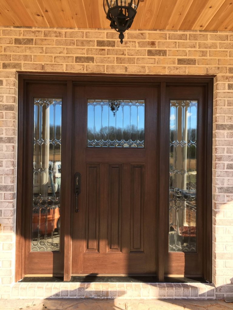 Mid-sized classic brick front porch idea in Raleigh with a roof extension by Southern Custom Doors | Outdoor Photos | Porch | Landscaping | Landscape Design | Outdoor Living Space | Porch Design Ideas | Outdoor Living Space Ideas | Backyard Design
