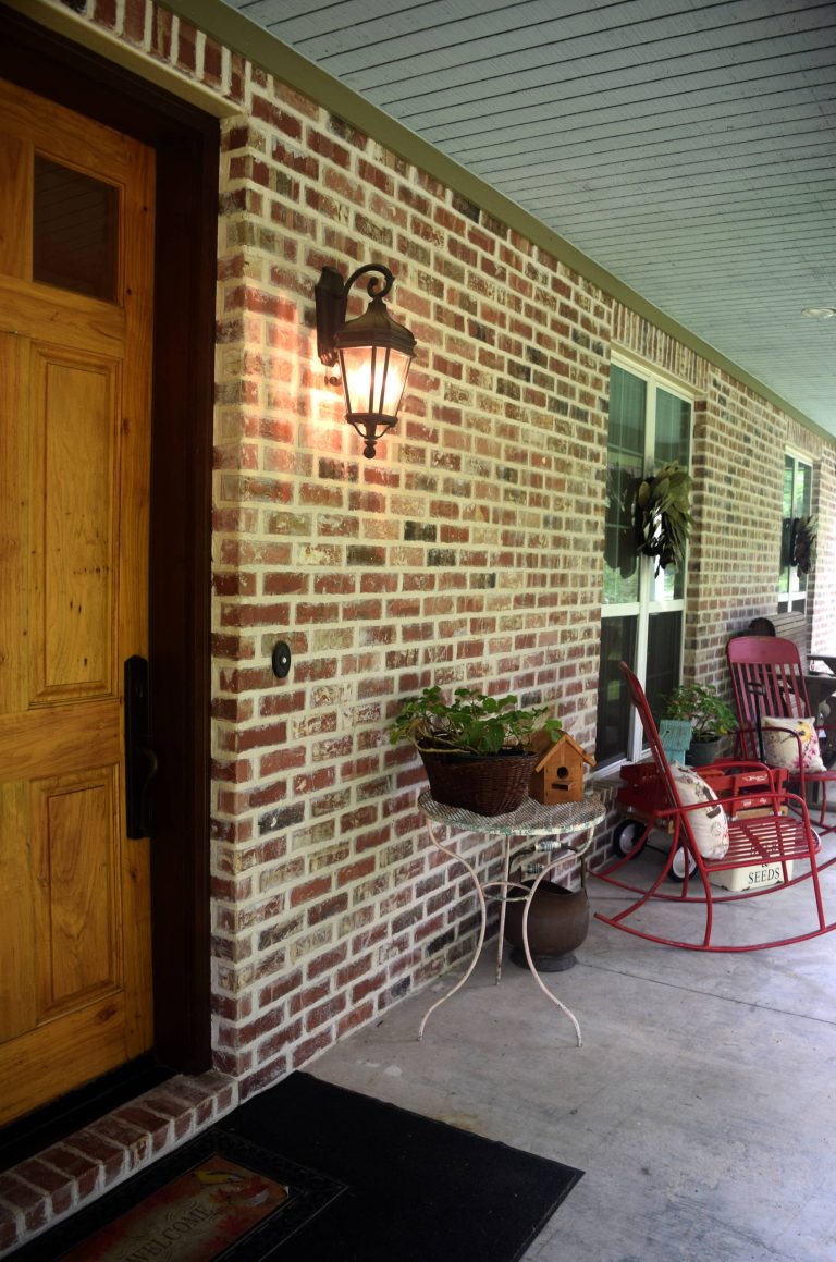 Mid-sized classic concrete front porch idea in Houston with a roof extension by Pelco Builders | Outdoor Photos | Porch | Landscaping | Landscape Design | Outdoor Living Space | Porch Design Ideas | Outdoor Living Space Ideas | Backyard Design