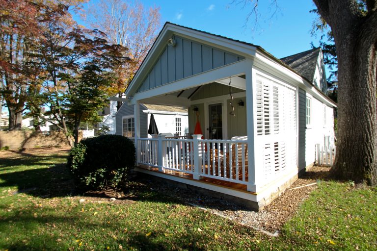 Mid-sized classic front porch idea in New York with a roof extension and decking by GULICK & Co. | Outdoor Photos | Porch | Landscaping | Landscape Design | Outdoor Living Space | Porch Design Ideas | Outdoor Living Space Ideas | Backyard Design