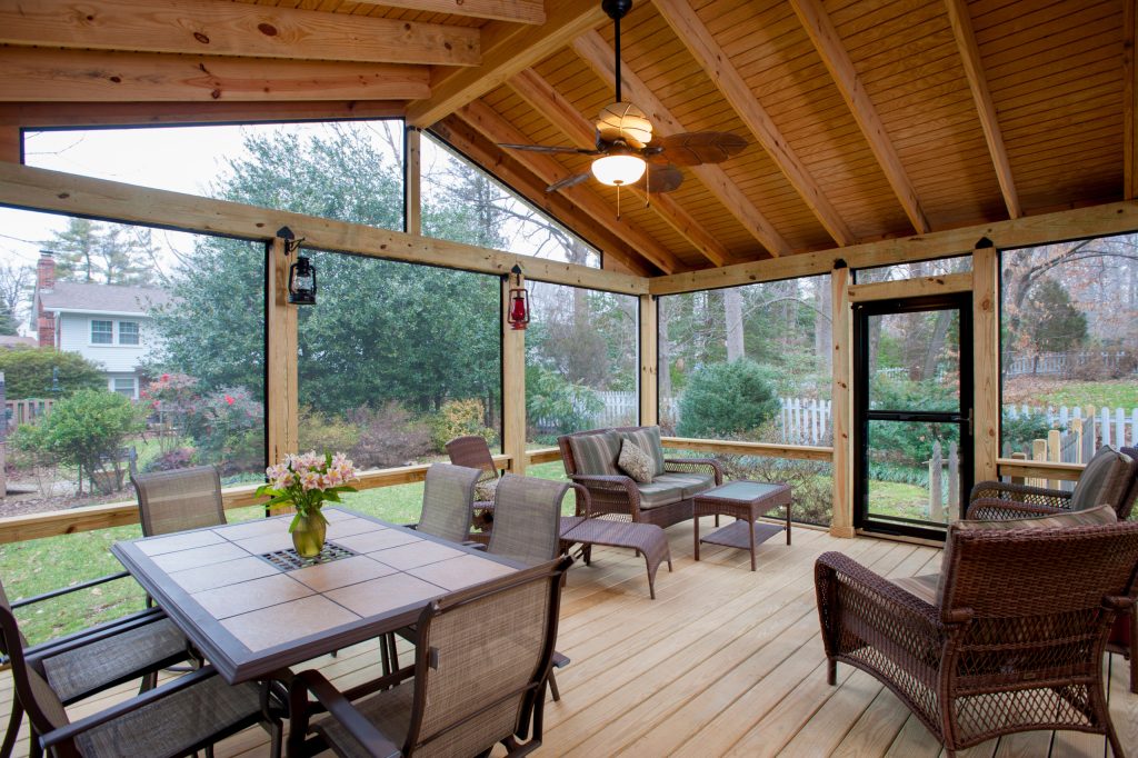 Mid-sized classic screened-in back porch idea in DC Metro with a roof extension by Design Builders, Inc. | Outdoor Photos | Porch | Landscaping | Landscape Design | Outdoor Living Space | Porch Design Ideas | Outdoor Living Space Ideas | Backyard Design