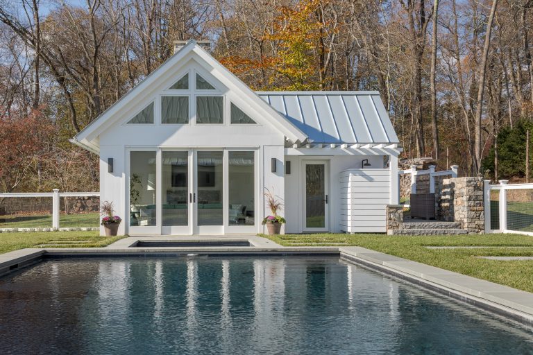 Mid-sized cottage backyard stone and rectangular lap pool house photo in New York