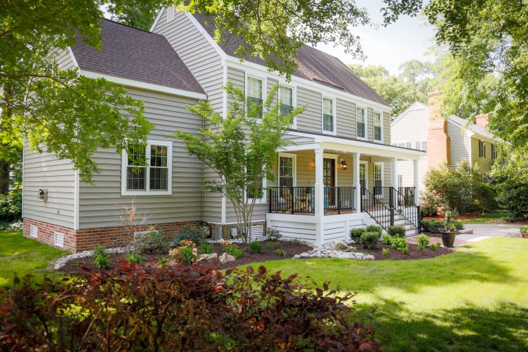 Mid-sized cottage front porch photo in Other with a roof extension by J.M. Froehler Construction | Outdoor Photos | Porch | Landscaping | Landscape Design | Outdoor Living Space | Porch Design Ideas | Outdoor Living Space Ideas | Backyard Design