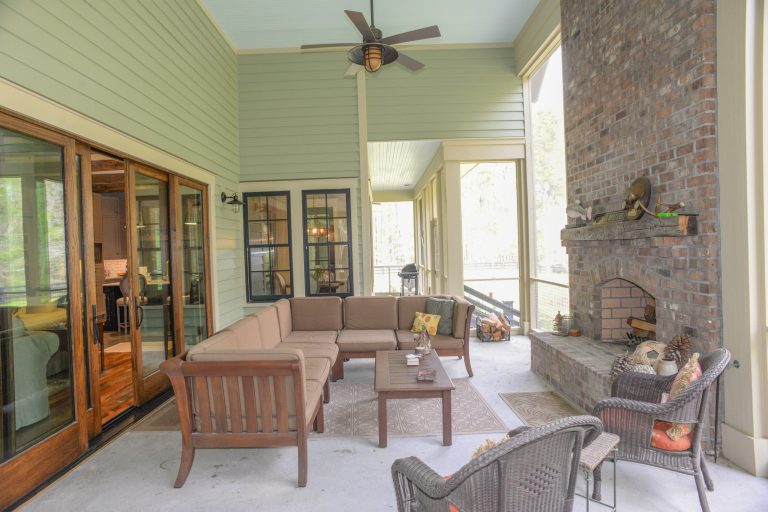 Mid-sized cottage screened-in back porch idea in Charleston with a roof extension by Lowcountry | Outdoor Photos | Porch | Landscaping | Landscape Design | Outdoor Living Space | Porch Design Ideas | Outdoor Living Space Ideas | Backyard Design