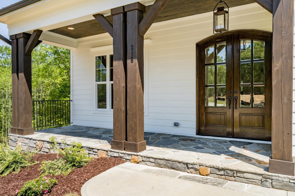 Mid-sized country front porch photo in Raleigh by Poythress Construction Company Inc. | Outdoor Photos | Porch | Landscaping | Landscape Design | Outdoor Living Space | Porch Design Ideas | Outdoor Living Space Ideas | Backyard Design