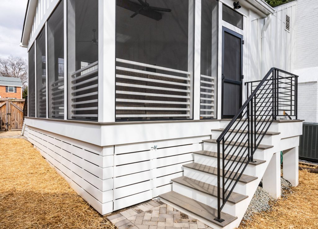 Mid-sized country screened-in back porch photo in DC Metro with decking and a roof extension by Koncept Design + Build | Outdoor Photos | Porch | Landscaping | Landscape Design | Outdoor Living Space | Porch Design Ideas | Outdoor Living Space Ideas | Backyard Design