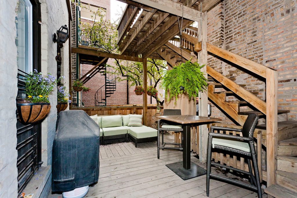 Mid-sized elegant back porch photo in Chicago with decking by Maison Fremont Properties | Outdoor Photos | Porch | Landscaping | Landscape Design | Outdoor Living Space | Porch Design Ideas | Outdoor Living Space Ideas | Backyard Design