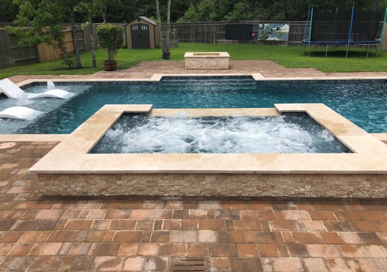 Mid-sized elegant backyard brick and rectangular lap hot tub photo in Houston