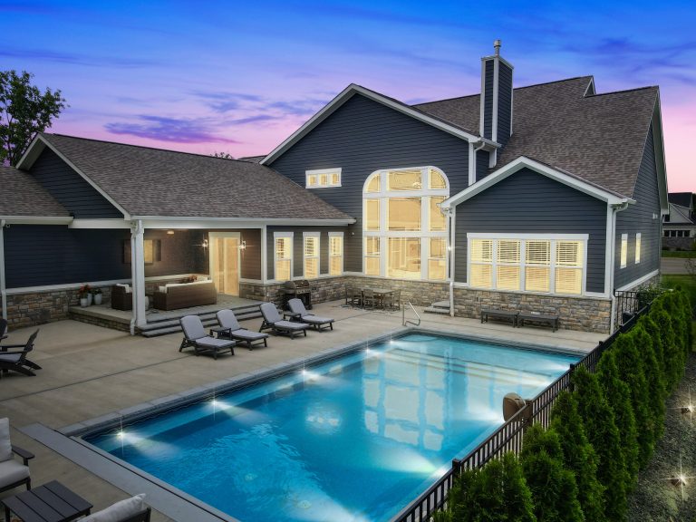 Mid-sized elegant backyard rectangular pool landscaping photo in Columbus