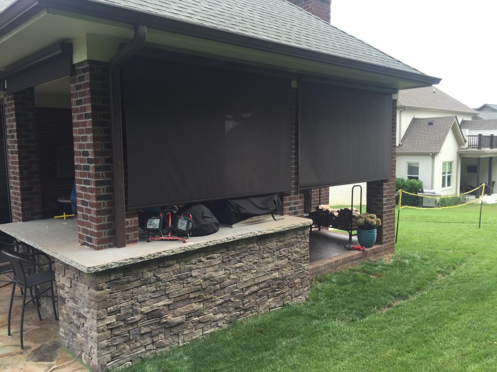 Mid-sized elegant backyard stone patio kitchen photo in Nashville with a roof extension