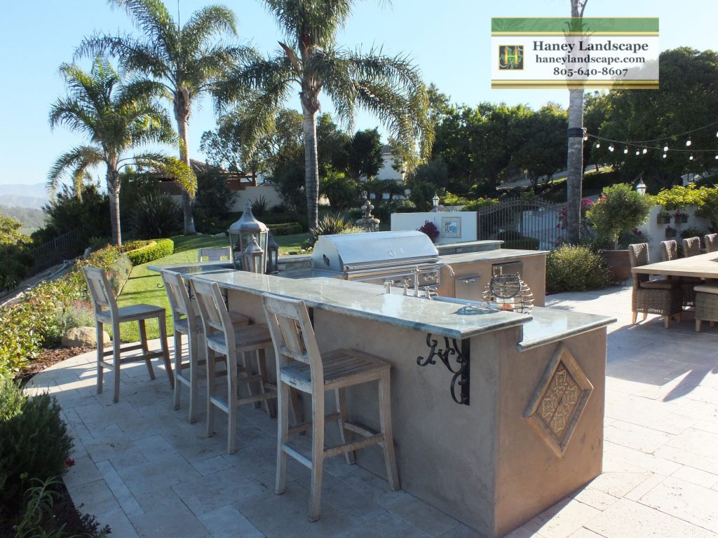 Mid-sized elegant backyard stone patio kitchen photo in Santa Barbara