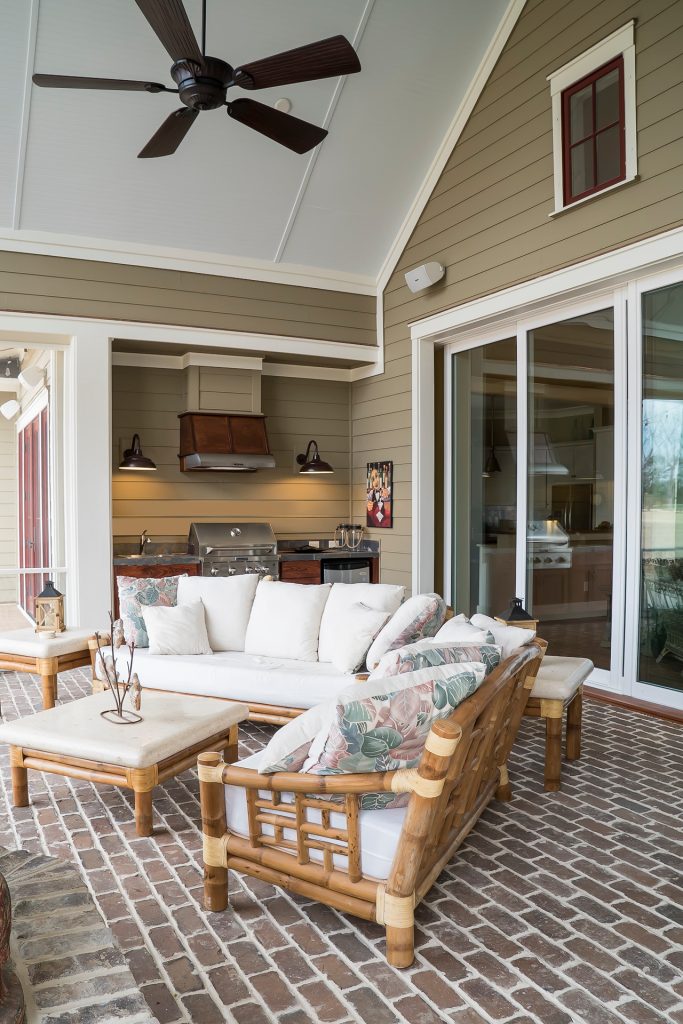 Mid-sized elegant brick screened-in back porch photo in Charleston with a roof extension by Court Atkins Group | Outdoor Photos | Porch | Landscaping | Landscape Design | Outdoor Living Space | Porch Design Ideas | Outdoor Living Space Ideas | Backyard Design