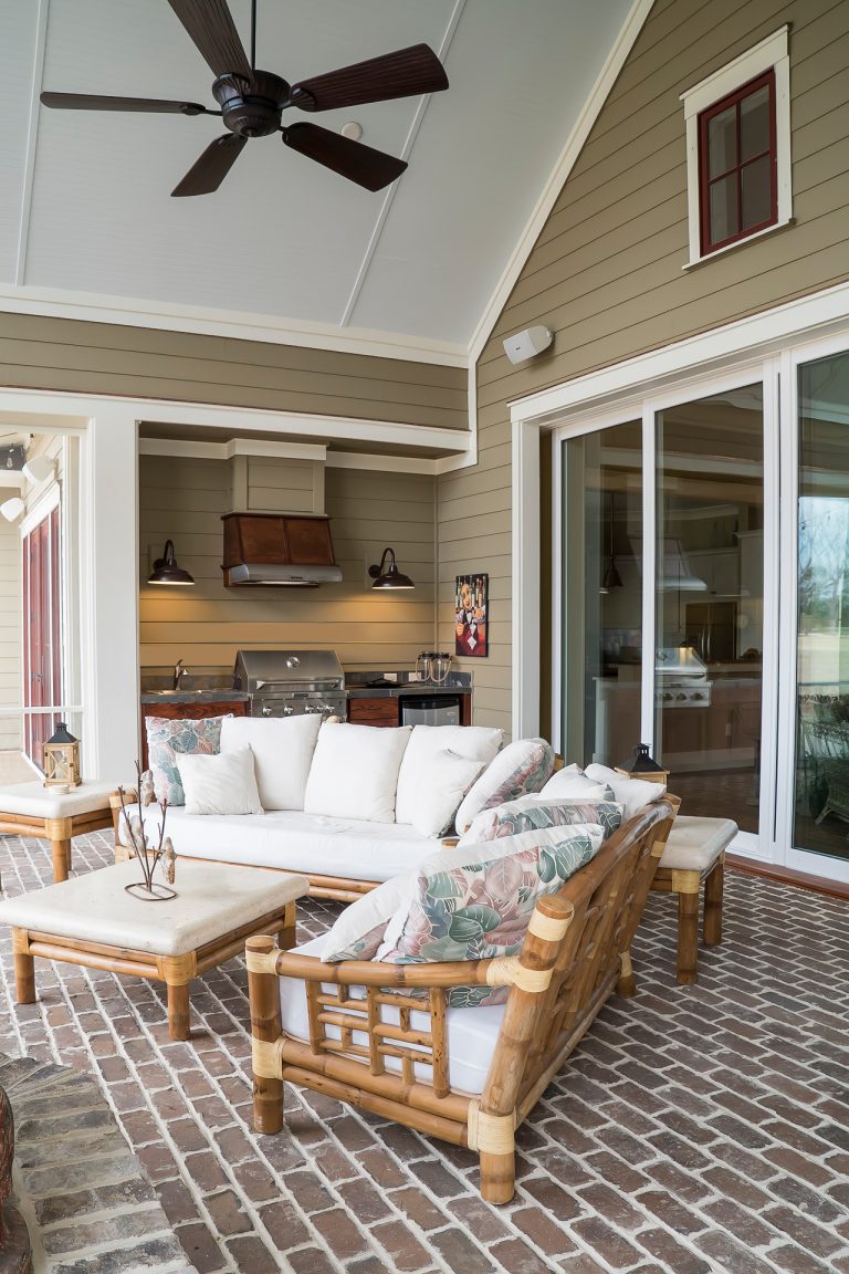 Mid-sized elegant brick screened-in back porch photo in Charleston with a roof extension by Court Atkins Group | Outdoor Photos | Porch | Landscaping | Landscape Design | Outdoor Living Space | Porch Design Ideas | Outdoor Living Space Ideas | Backyard Design