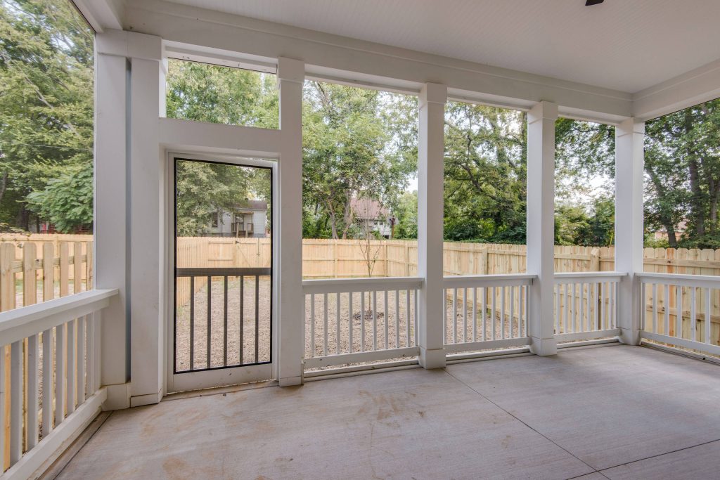 Mid-sized elegant concrete screened-in back porch photo in Nashville with a roof extension by White Pines Building Group | Outdoor Photos | Porch | Landscaping | Landscape Design | Outdoor Living Space | Porch Design Ideas | Outdoor Living Space Ideas | Backyard Design