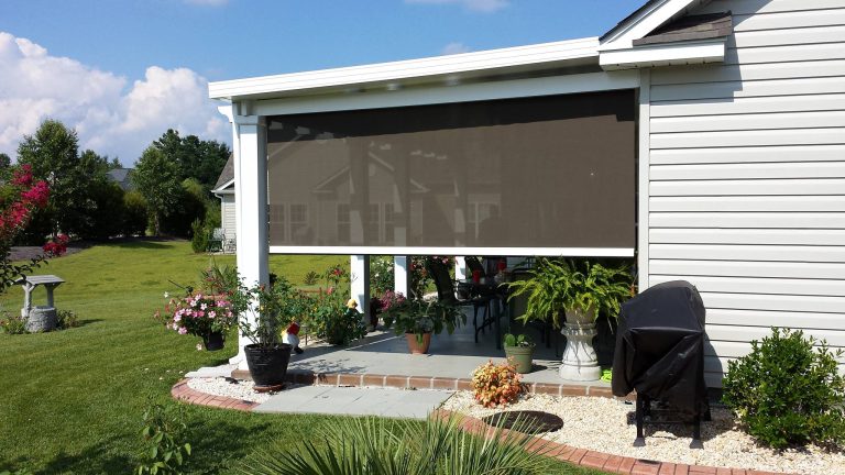 Mid-sized elegant concrete screened-in back porch photo in Other with a roof extension by SHADE & SHUTTER EXPO | Outdoor Photos | Porch | Landscaping | Landscape Design | Outdoor Living Space | Porch Design Ideas | Outdoor Living Space Ideas | Backyard Design