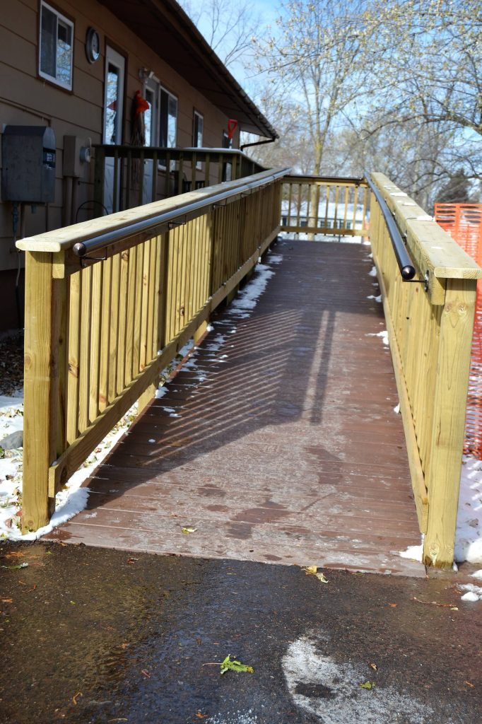 Mid-sized elegant front porch photo in Other by KV Build | Outdoor Photos | Porch | Landscaping | Landscape Design | Outdoor Living Space | Porch Design Ideas | Outdoor Living Space Ideas | Backyard Design