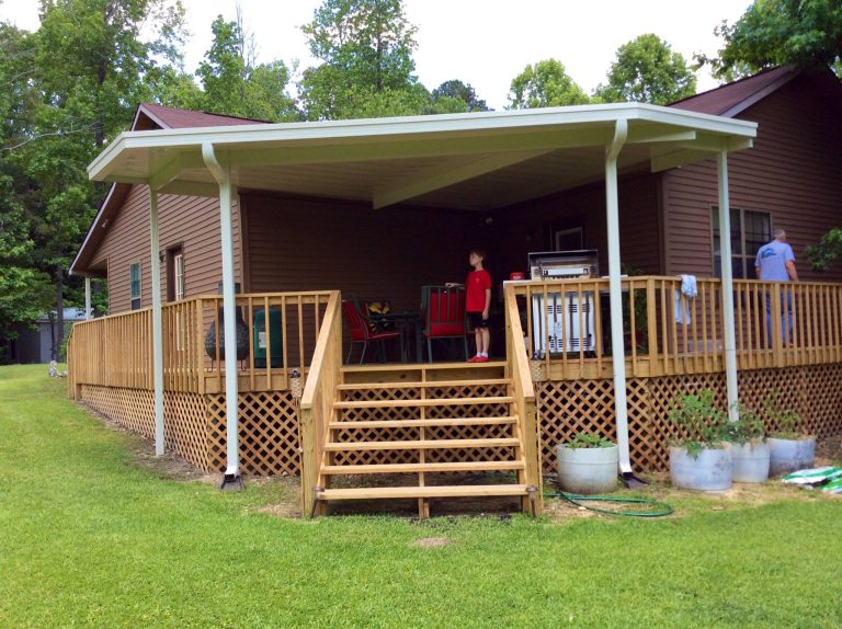 Mid-sized elegant porch photo in Other with decking and a roof extension by Reliable Fabricating | Outdoor Photos | Porch | Landscaping | Landscape Design | Outdoor Living Space | Porch Design Ideas | Outdoor Living Space Ideas | Backyard Design
