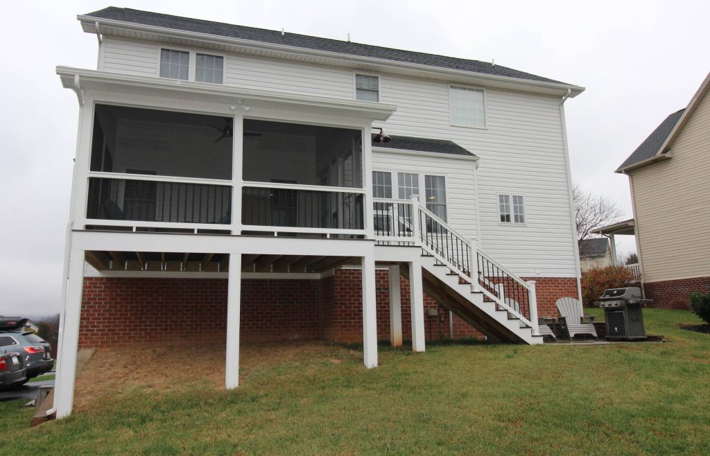 Mid-sized elegant screened-in back porch photo in Other with a roof extension by Construction Marketing, LLC | Outdoor Photos | Porch | Landscaping | Landscape Design | Outdoor Living Space | Porch Design Ideas | Outdoor Living Space Ideas | Backyard Design