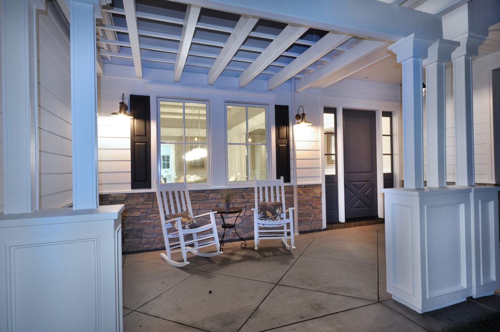 Mid-sized elegant stone back porch photo in Detroit with a roof extension by Michigan Chandelier Company | Outdoor Photos | Porch | Landscaping | Landscape Design | Outdoor Living Space | Porch Design Ideas | Outdoor Living Space Ideas | Backyard Design