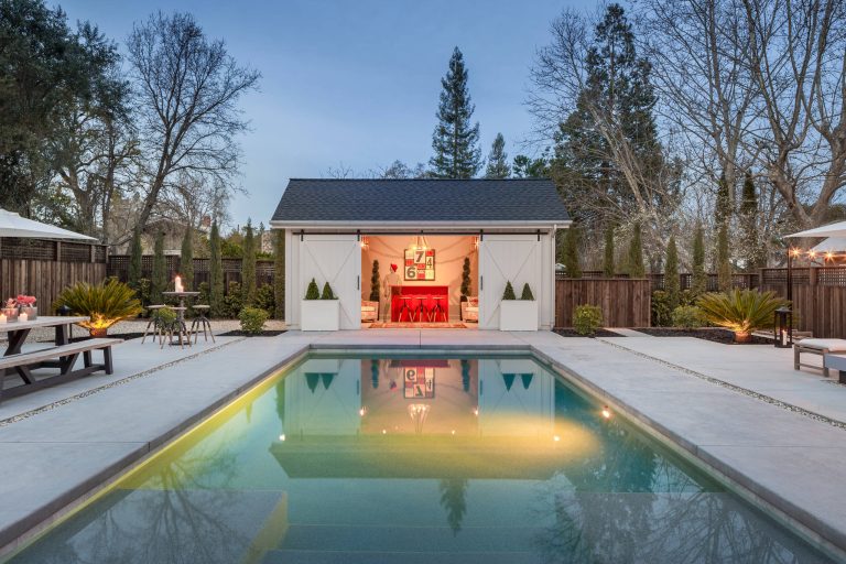 Mid-sized farmhouse backyard concrete paver and rectangular pool house photo in San Francisco