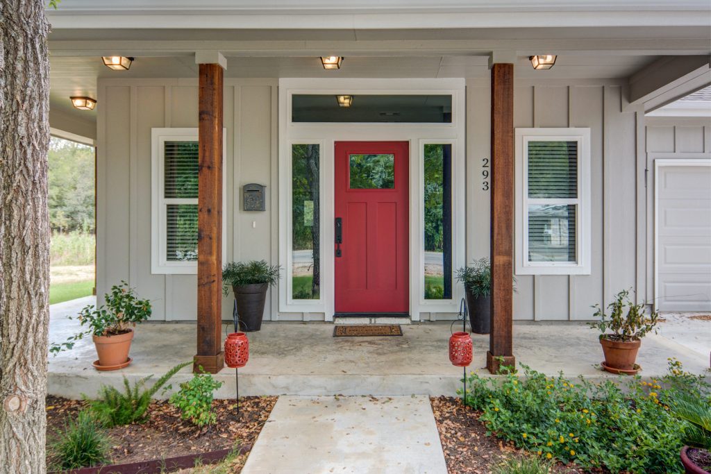 Mid-sized farmhouse concrete front porch idea in Austin with a roof extension by Texas Classic Custom Homes | Outdoor Photos | Porch | Landscaping | Landscape Design | Outdoor Living Space | Porch Design Ideas | Outdoor Living Space Ideas | Backyard Design